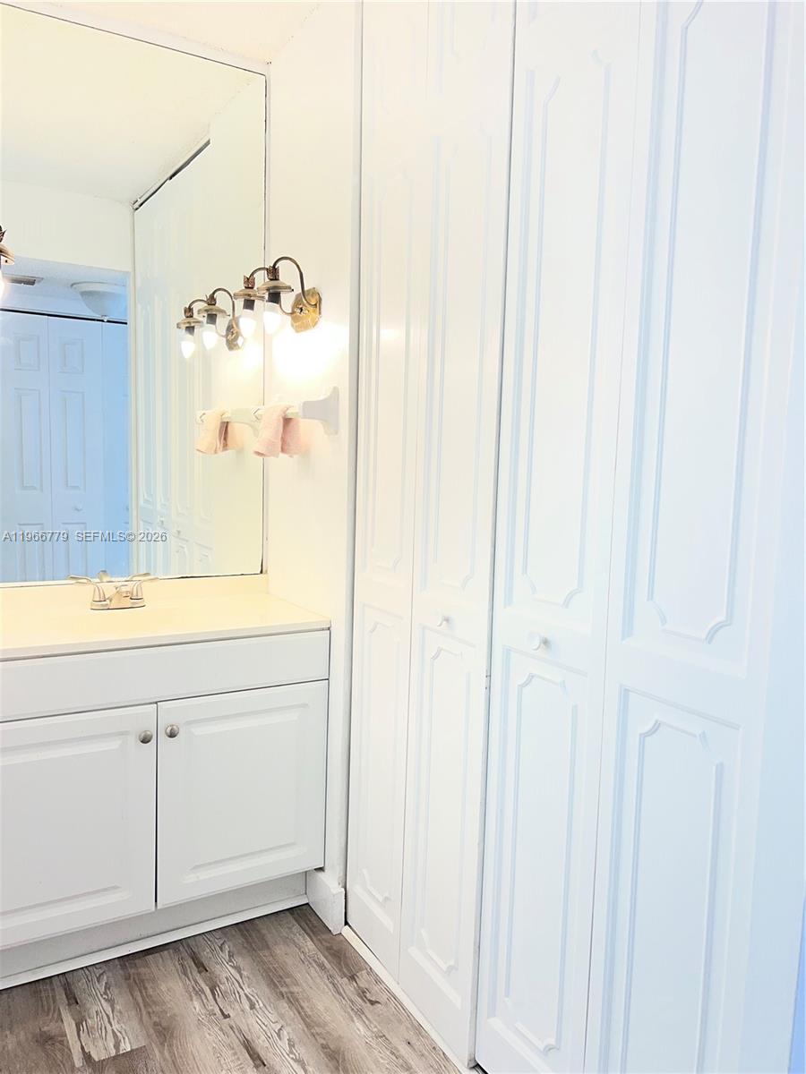 3690 Inverrary Drive, Unit 1K Lauderhill, FL 33319 - Photo 15 of 34 a bathroom with a shower and a sink