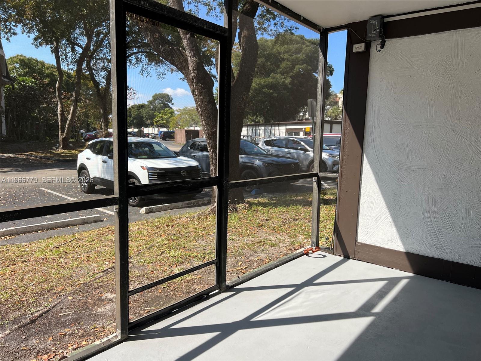 3690 Inverrary Drive, Unit 1K Lauderhill, FL 33319 - Photo 27 of 34 a view of a room with wooden floor and iron stairs