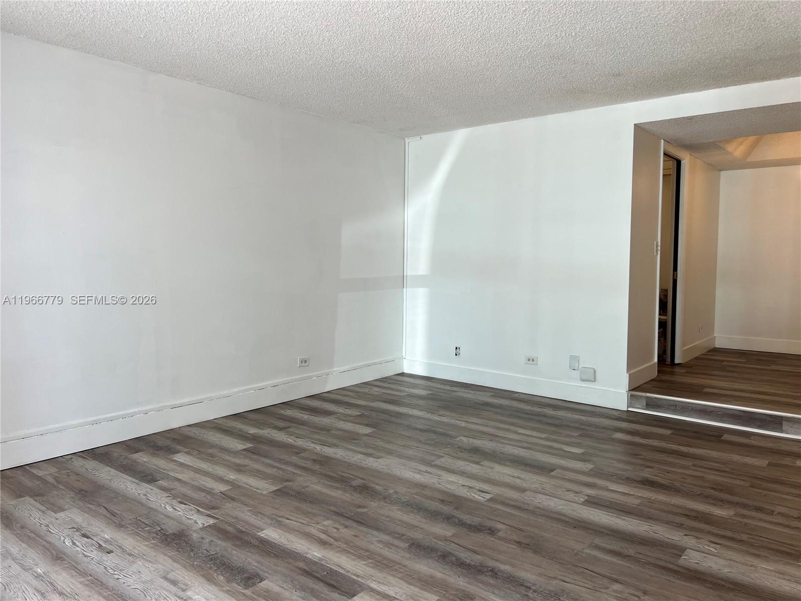 3690 Inverrary Drive, Unit 1K Lauderhill, FL 33319 - Photo 33 of 34 a view of a room with wooden floor and fence