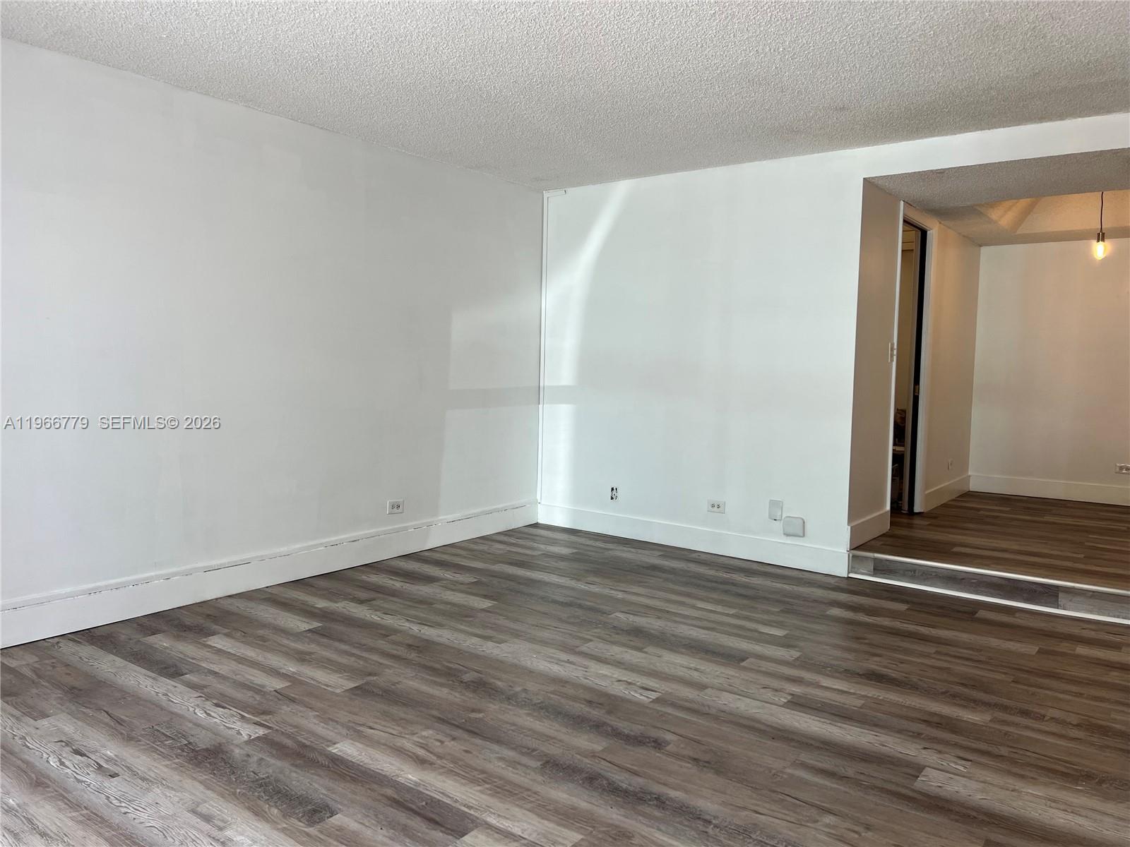3690 Inverrary Drive, Unit 1K Lauderhill, FL 33319 - Photo 34 of 34 a view of a room with wooden floor