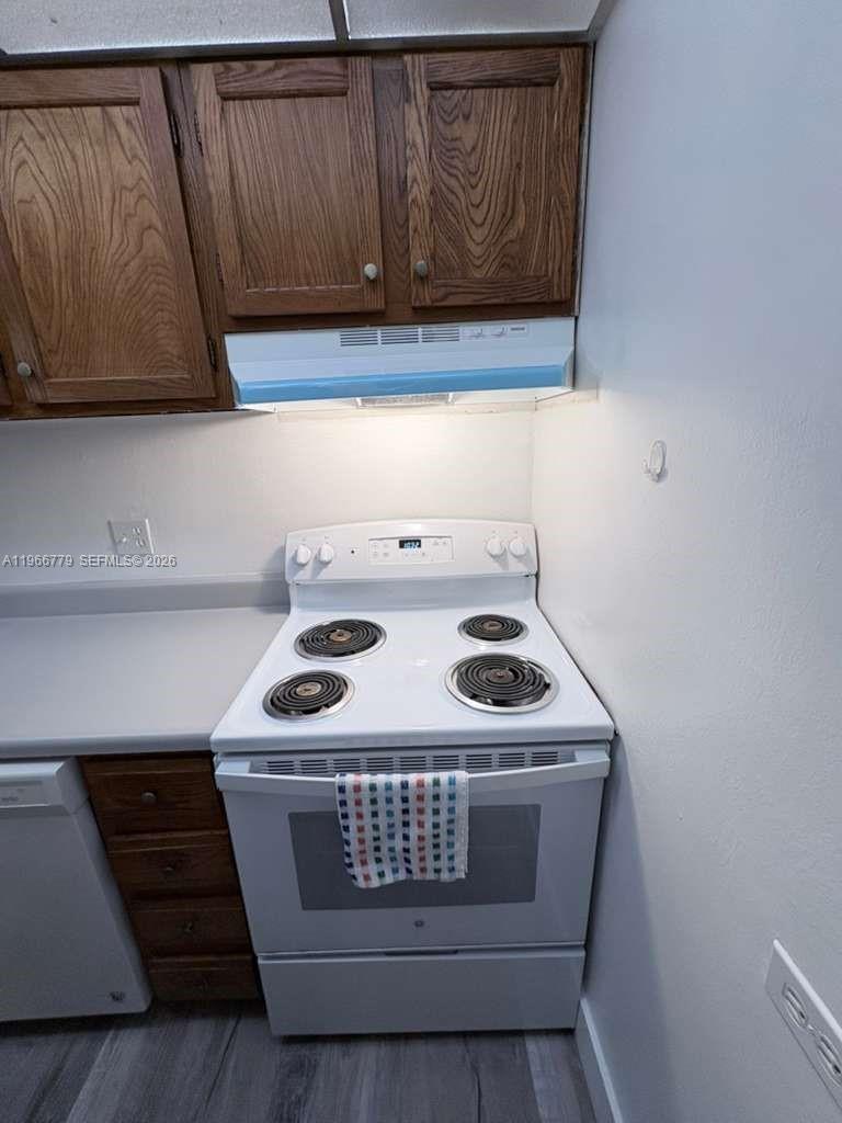 3690 Inverrary Drive, Unit 1K Lauderhill, FL 33319 - Photo 10 of 34 a utility room with dryer and washer