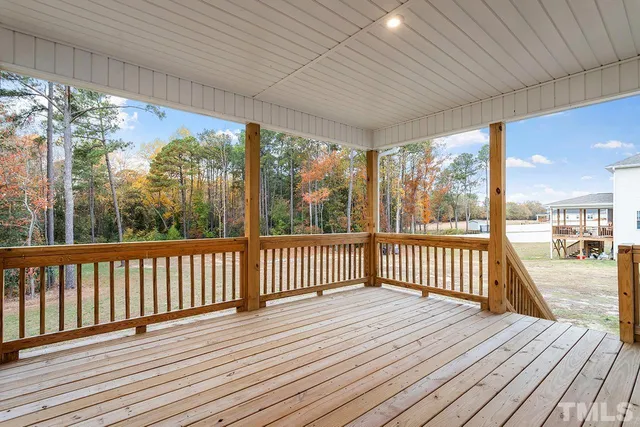 a view of balcony with wooden floor