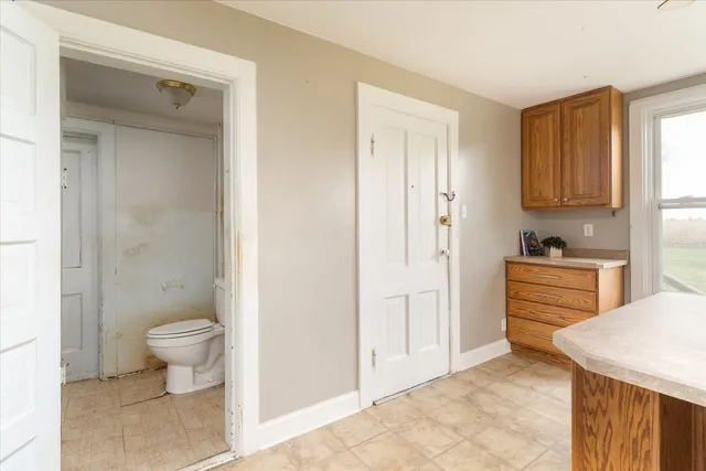 a view of a bathroom with sink toilet and a window