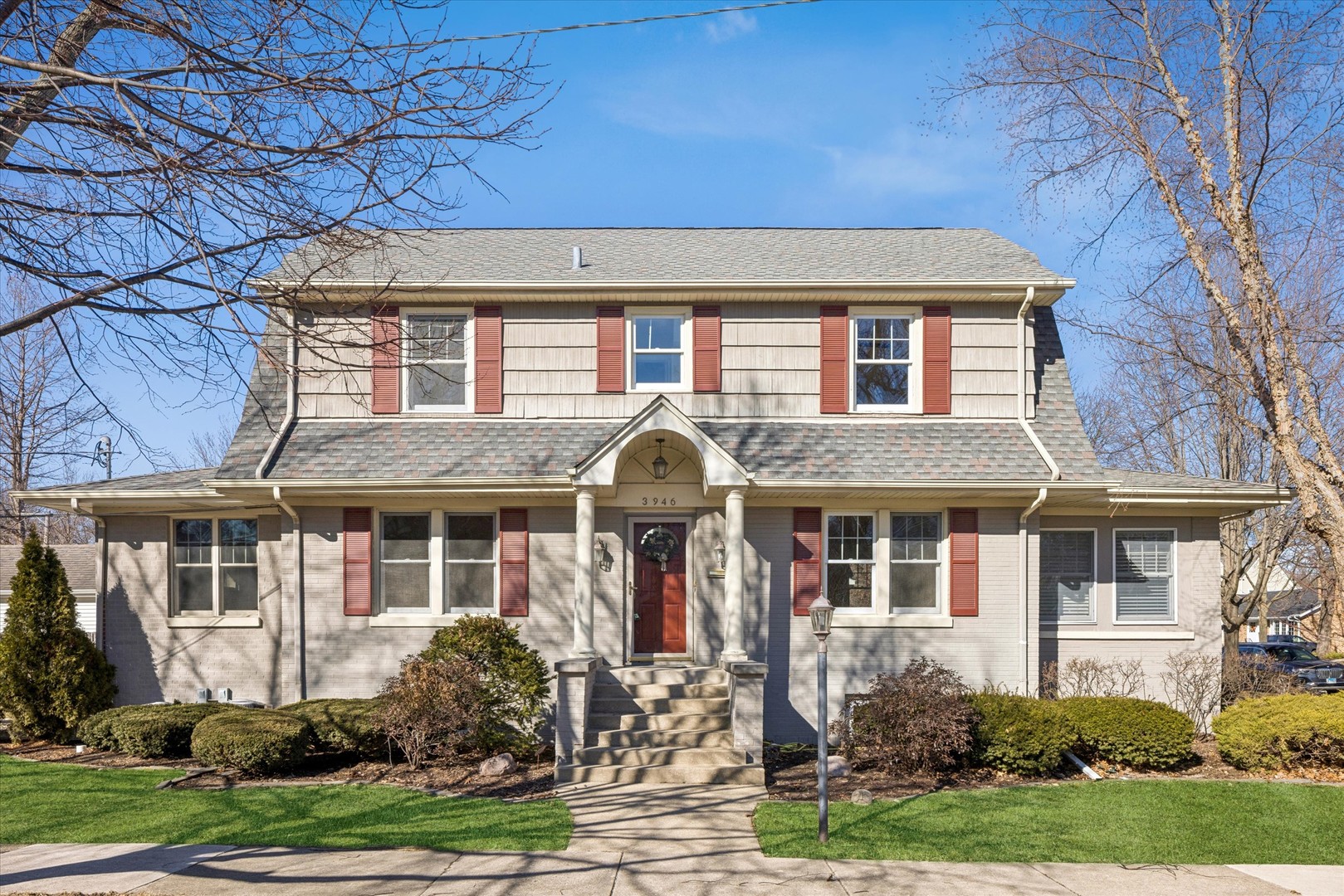 front view of a house with a yard
