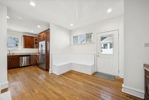 a view of a kitchen with a sink and a refrigerator