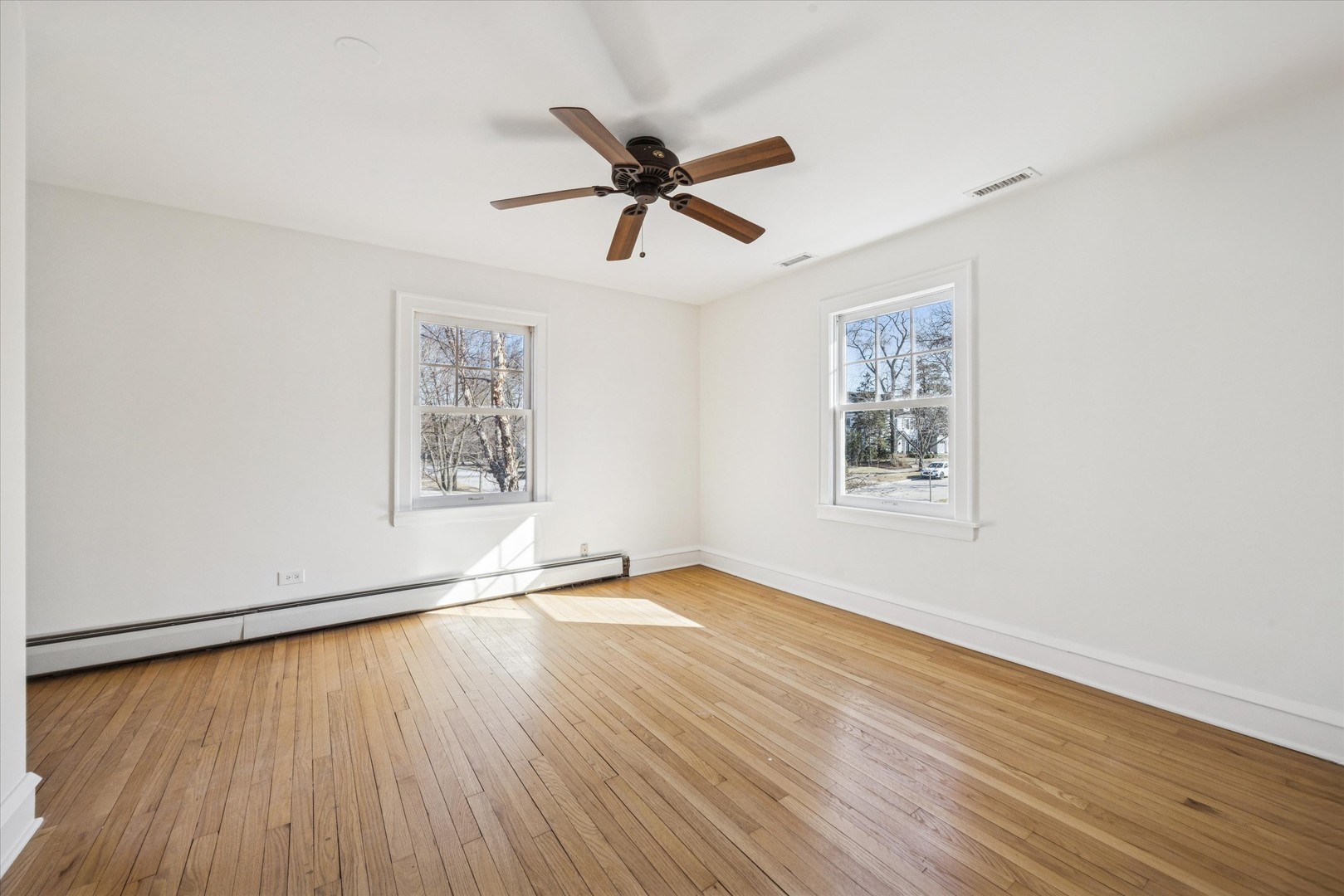 3946 Howard Avenue Western Springs, IL 60558 - Photo 15 of 28 a view of empty room with wooden floor and fan