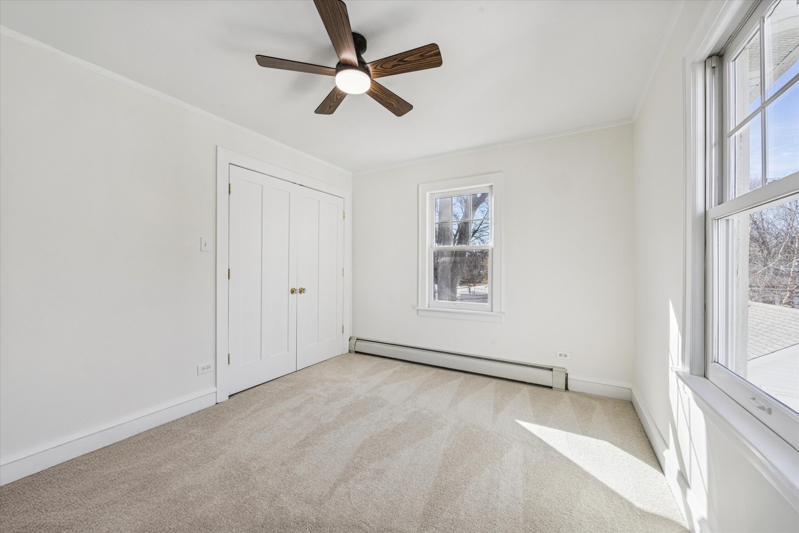 3946 Howard Avenue Western Springs, IL 60558 - Photo 19 of 28 an empty room with windows and fan