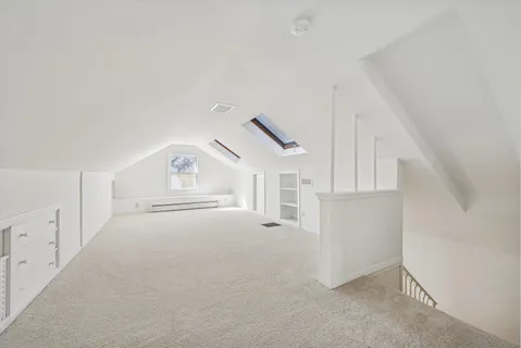 a view of empty room with white walls