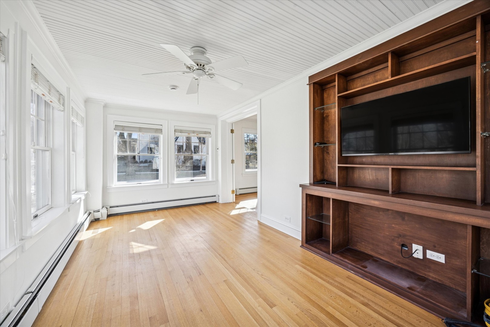 3946 Howard Avenue Western Springs, IL 60558 - Photo 6 of 28 a view of an empty room with wooden floor and a window