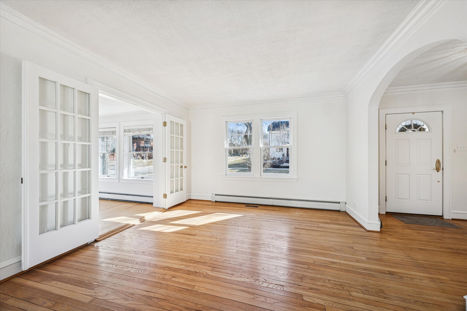 3946 Howard Avenue Western Springs, IL 60558 - Photo 7 of 28 a view of an empty room with window and wooden floor