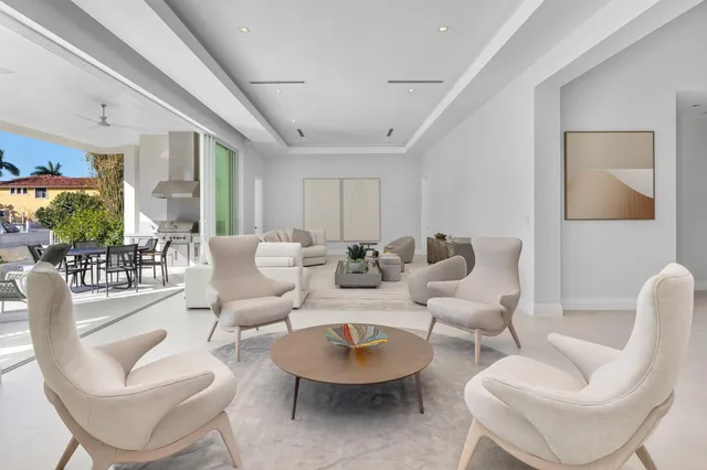 a bedroom with a bed and a lamp with the dresser