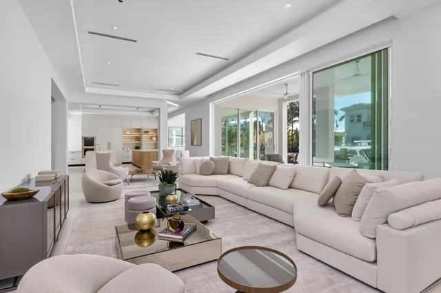 a view of a balcony with floor to ceiling windows and wooden floor