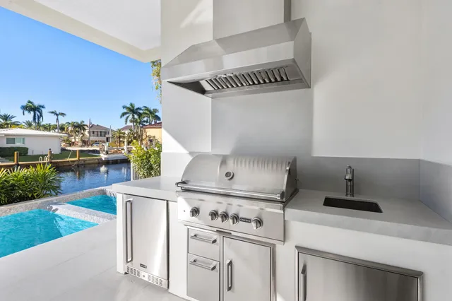 a view of a balcony with two chairs and a table