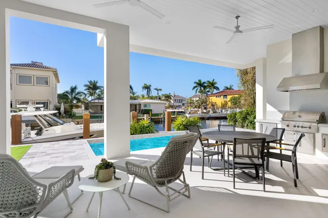 a view of a house with a yard from a balcony