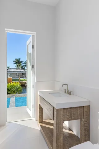 a view of a house with backyard porch and sitting area