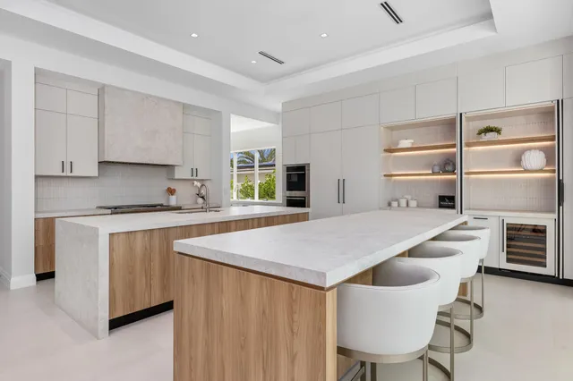 a view of a dining room with furniture and a floor to ceiling window