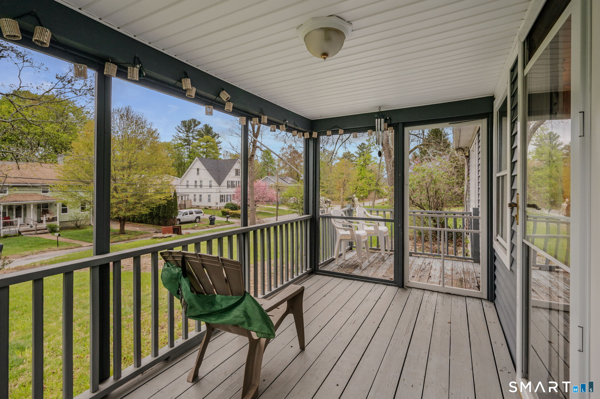 414 Main Street Sprague, CT 06330 - Photo 12 of 34 a view of a porch with wooden floor and outdoor seating