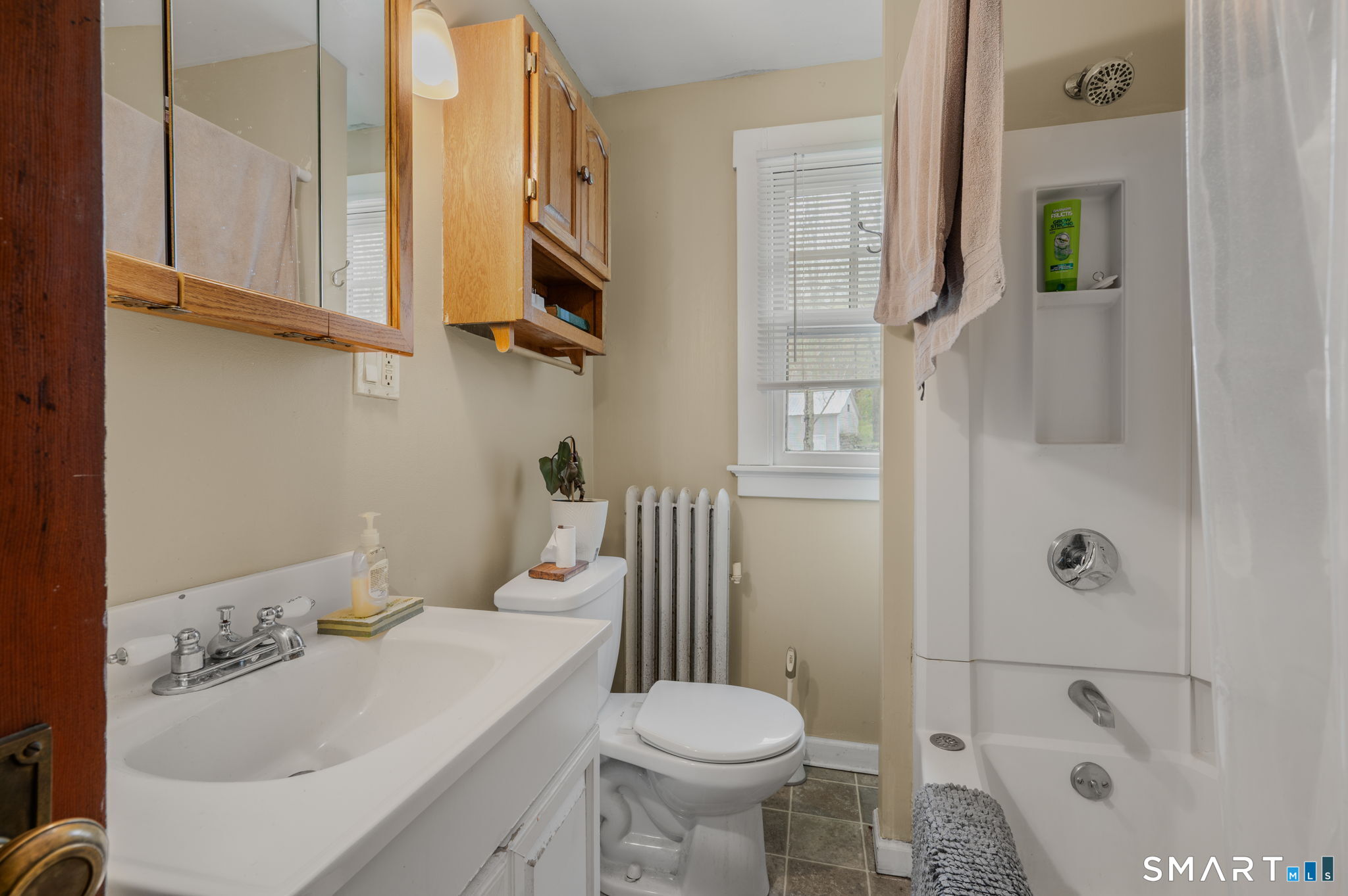 414 Main Street Sprague, CT 06330 - Photo 14 of 34 a bathroom with a sink toilet and shower