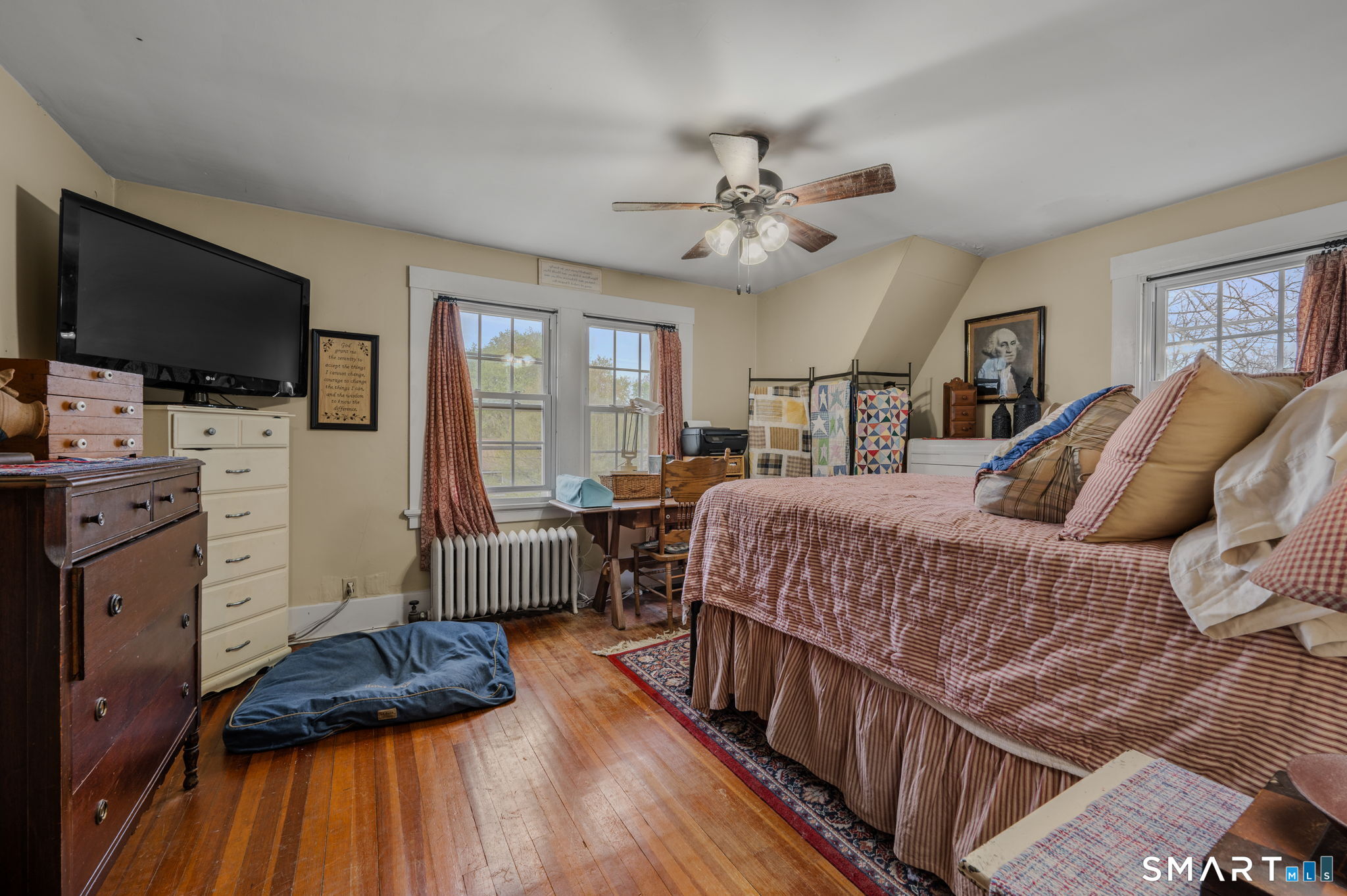 414 Main Street Sprague, CT 06330 - Photo 20 of 34 a bedroom with a bed and a flat screen tv