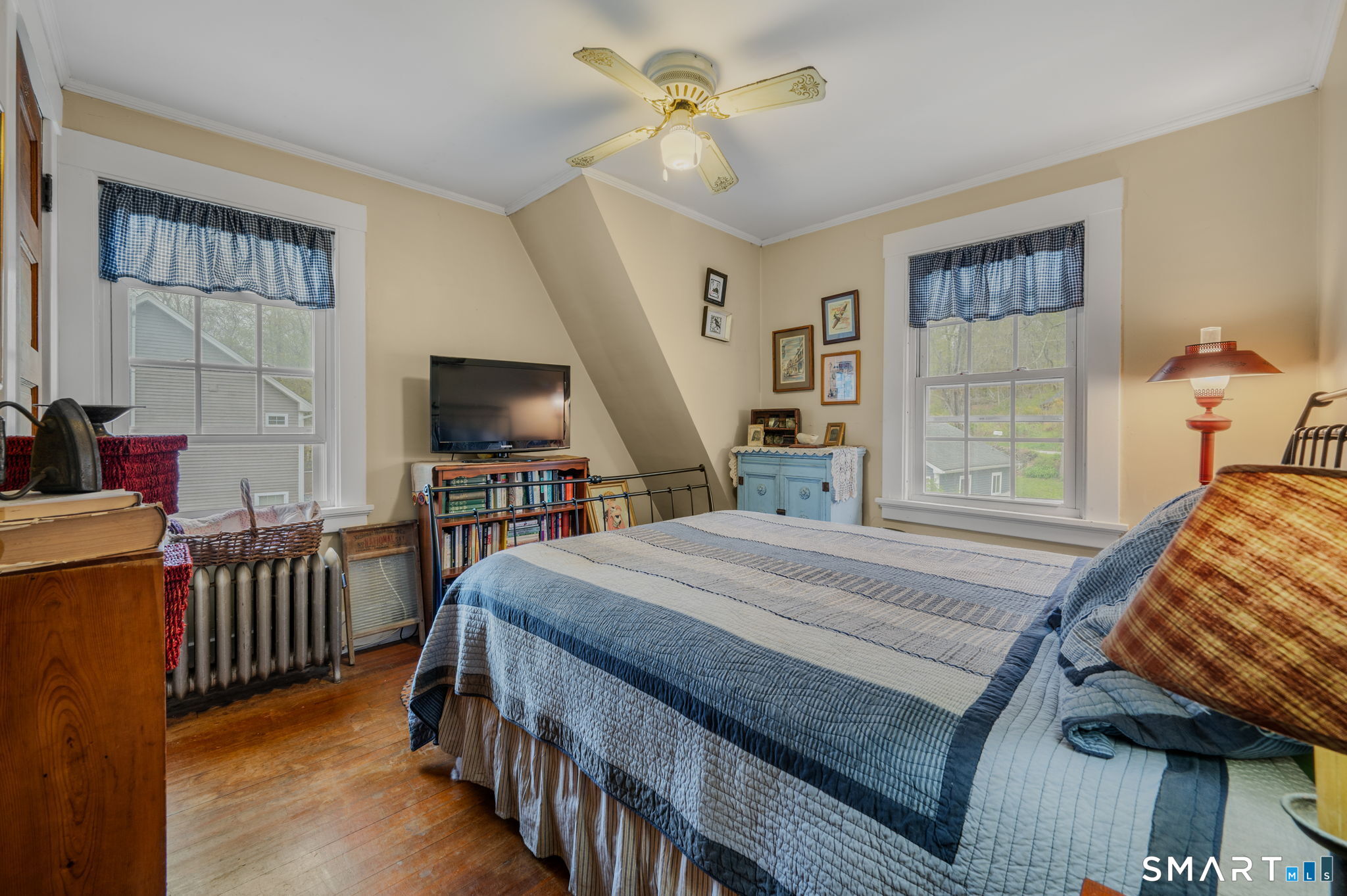 414 Main Street Sprague, CT 06330 - Photo 22 of 34 a bedroom with a bed and a flat screen tv