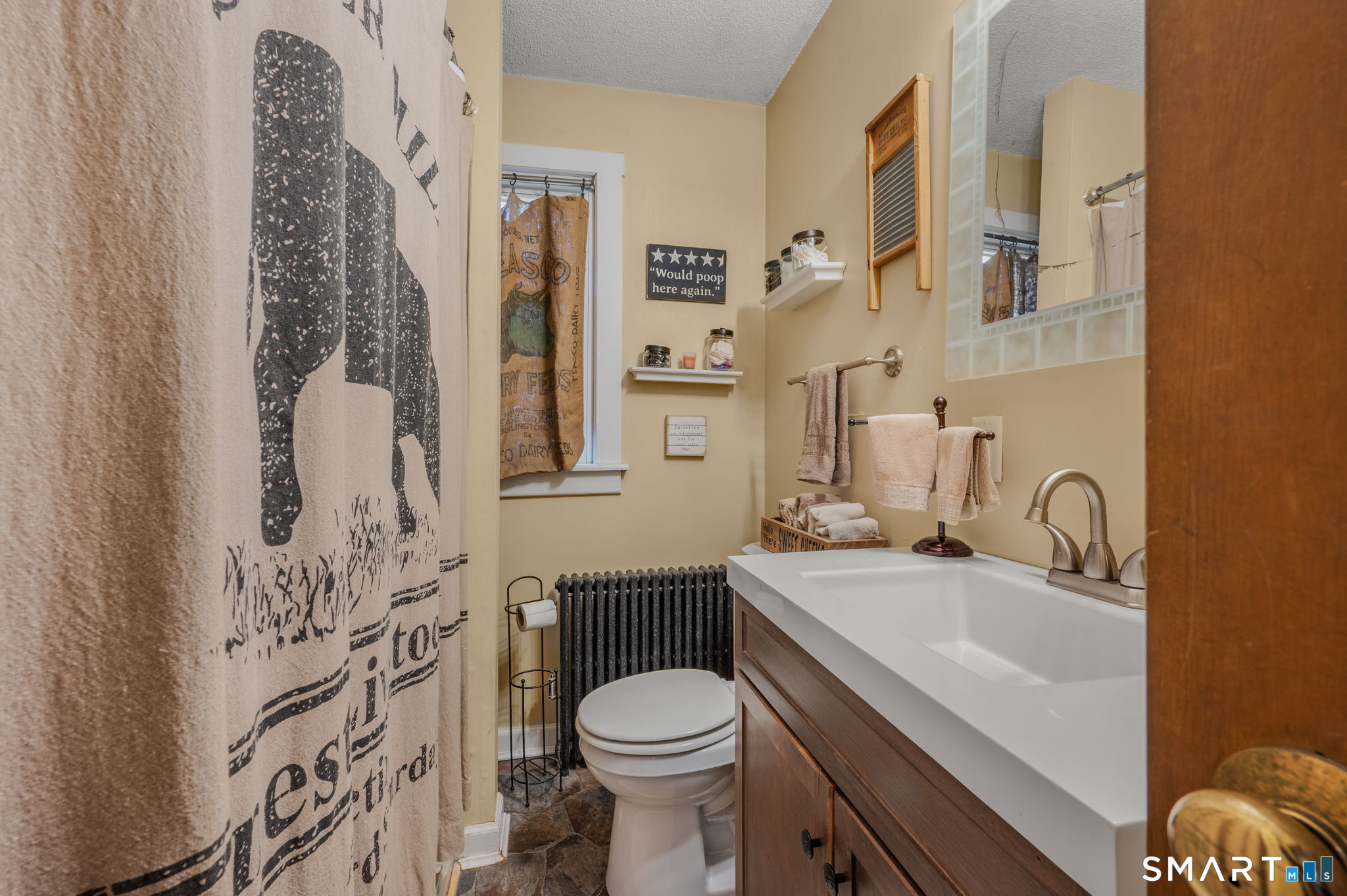 414 Main Street Sprague, CT 06330 - Photo 23 of 34 a bathroom with a sink toilet and shower