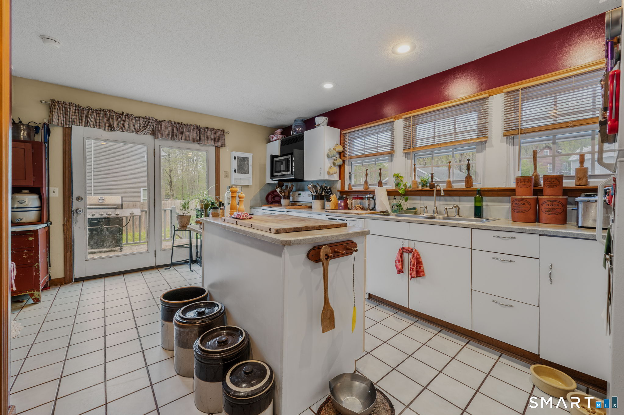 414 Main Street Sprague, CT 06330 - Photo 25 of 34 a kitchen with a sink stove and cabinets