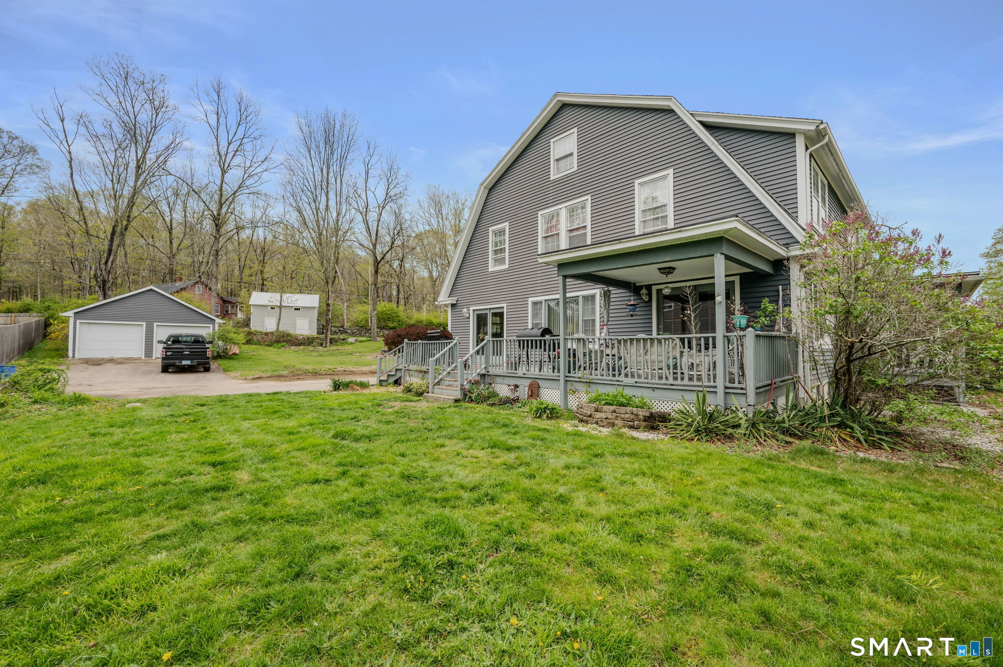 414 Main Street Sprague, CT 06330 - Photo 3 of 34 a front view of a house with a yard