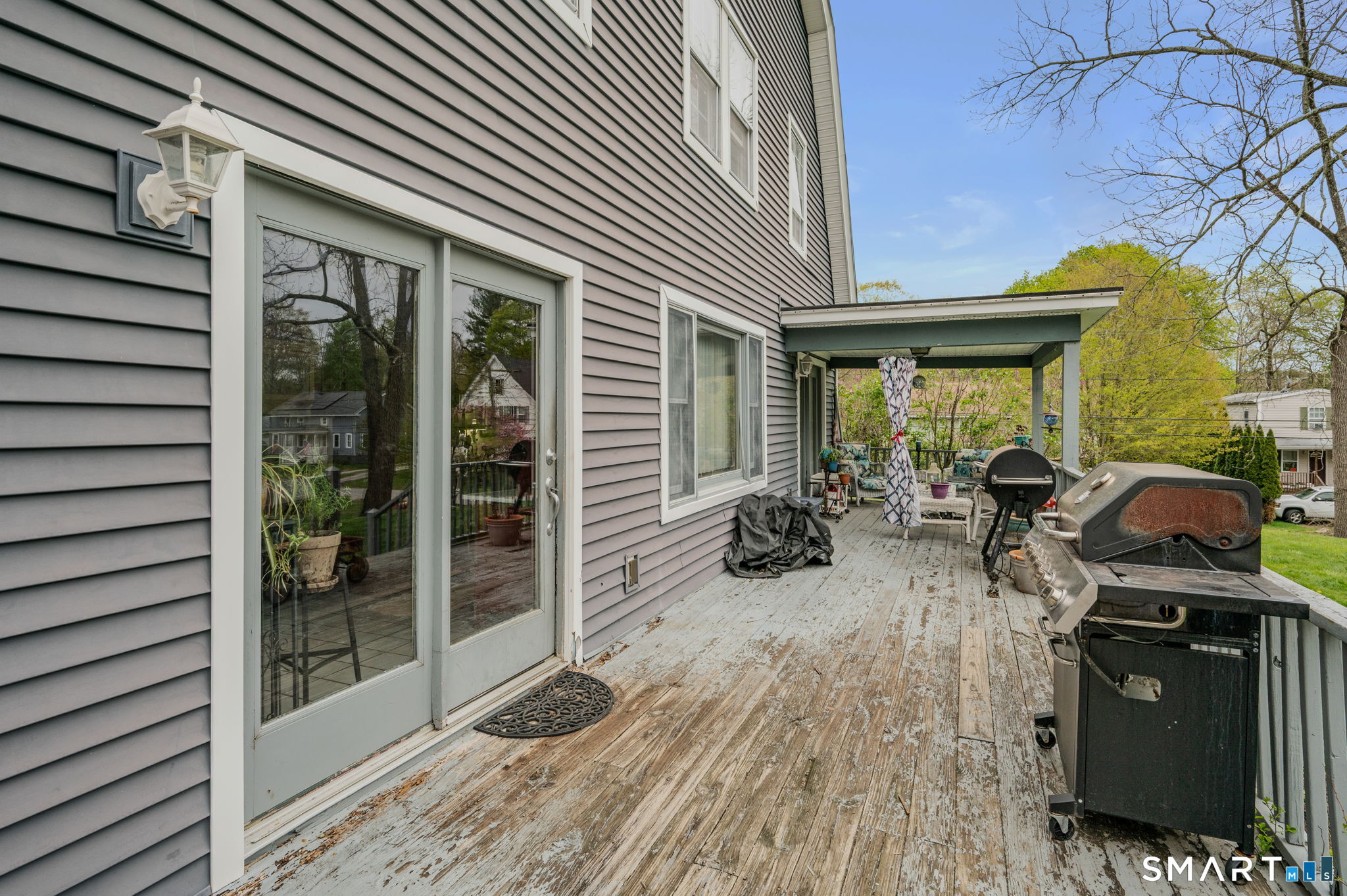 414 Main Street Sprague, CT 06330 - Photo 6 of 34 a view of a patio with table and chairs and wooden floor