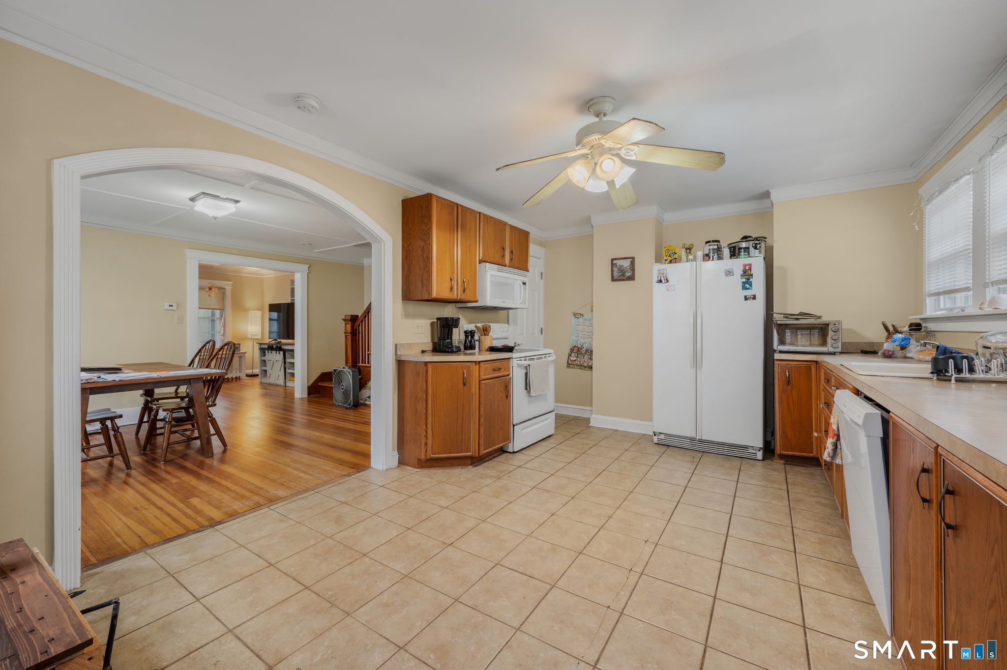 414 Main Street Sprague, CT 06330 - Photo 7 of 34 a kitchen with stainless steel appliances kitchen island granite countertop a refrigerator a stove top oven and a sink