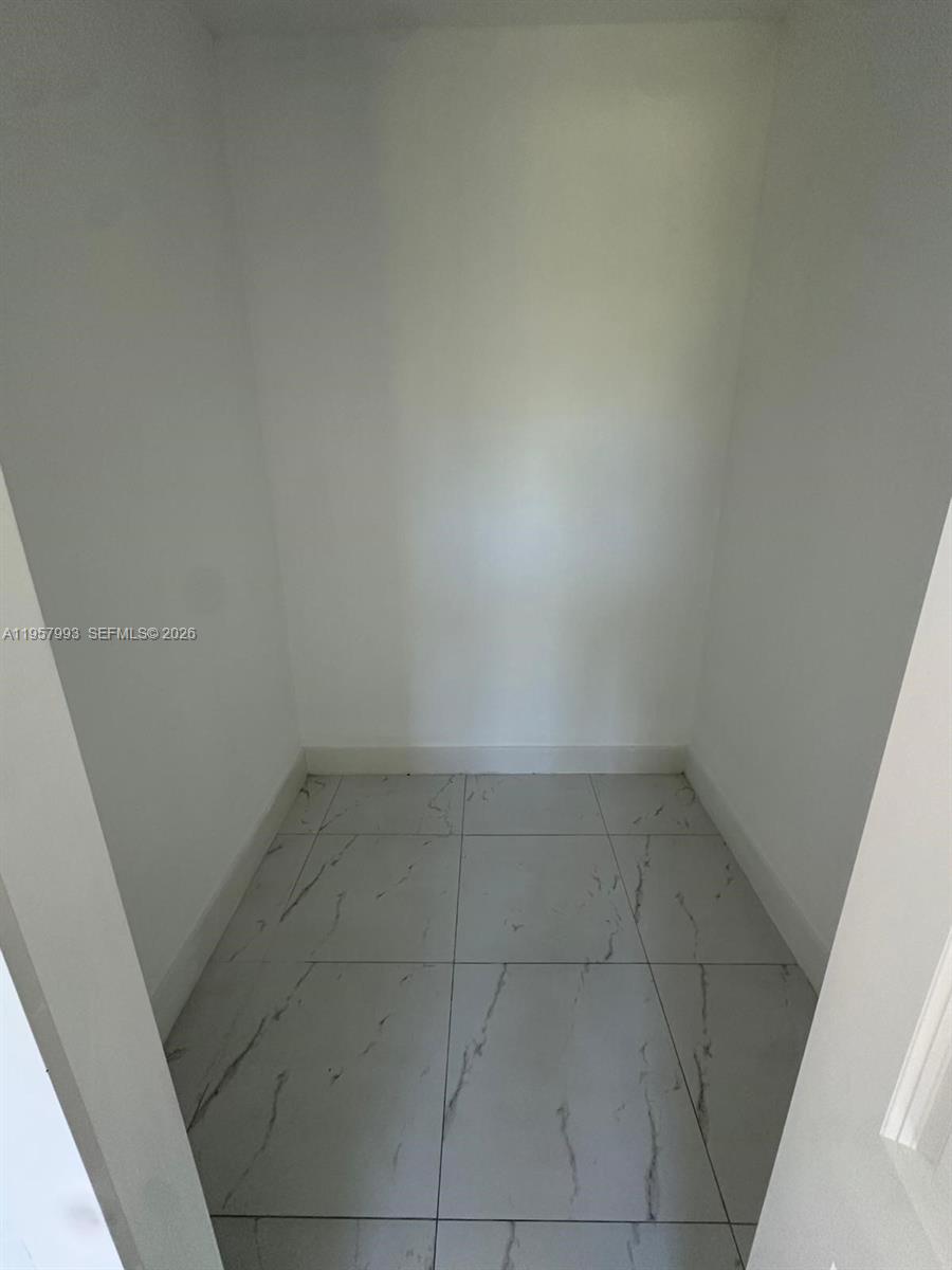 4660-4662 26th Street Southwest Lehigh Acres, FL 33973 - Photo 16 of 22 close up of a white marble wall