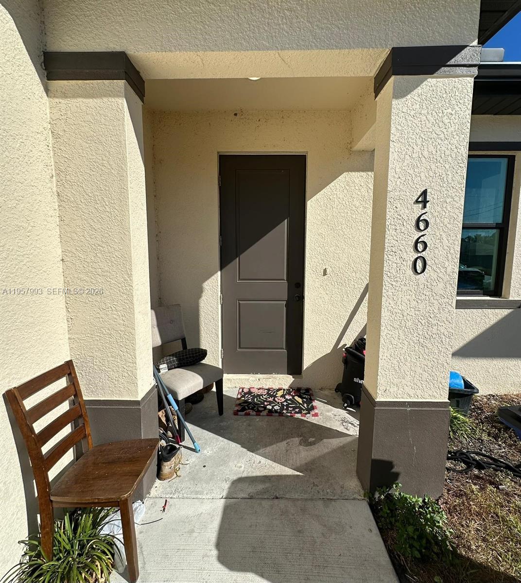 4660-4662 26th Street Southwest Lehigh Acres, FL 33973 - Photo 4 of 22 a bathroom with a sink and a mirror