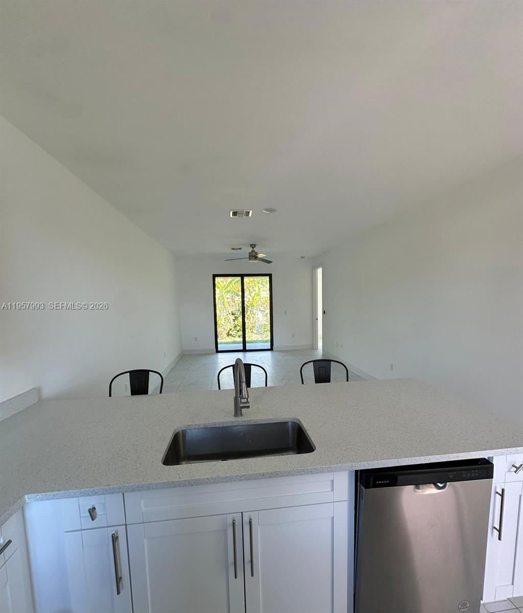 4660-4662 26th Street Southwest Lehigh Acres, FL 33973 - Photo 9 of 22 a bathroom with a sink and mirror