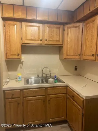 a white refrigerator freezer sitting inside of a kitchen