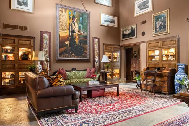 a kitchen with a stove a sink and a window