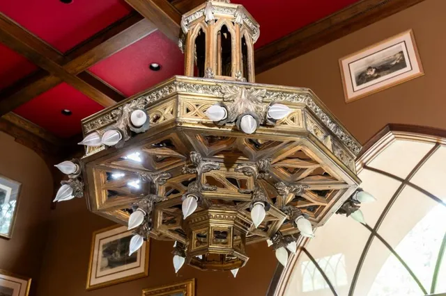 a living room with furniture and floor to ceiling windows