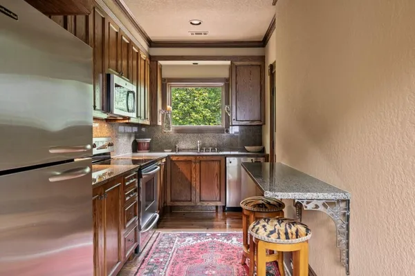 a kitchen with a stove and cabinets