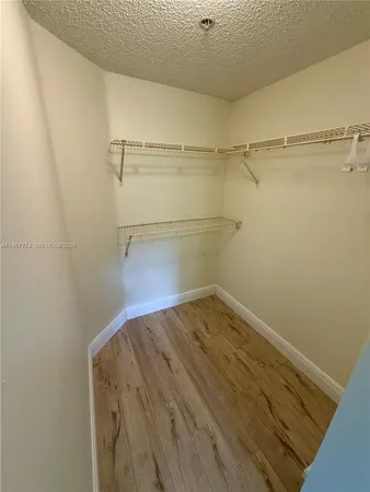 a view of a room with racks on the wall