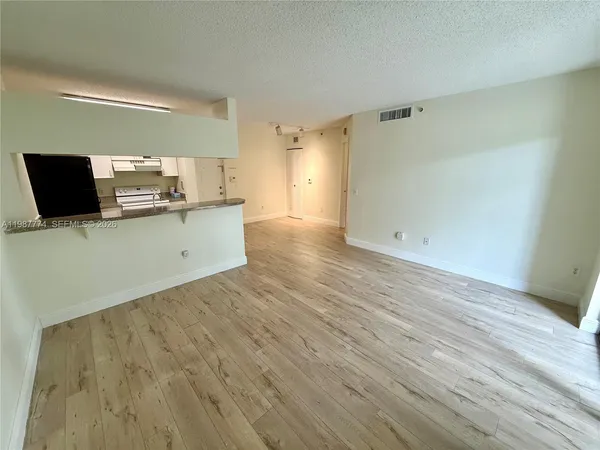 a view of kitchen with wooden floor