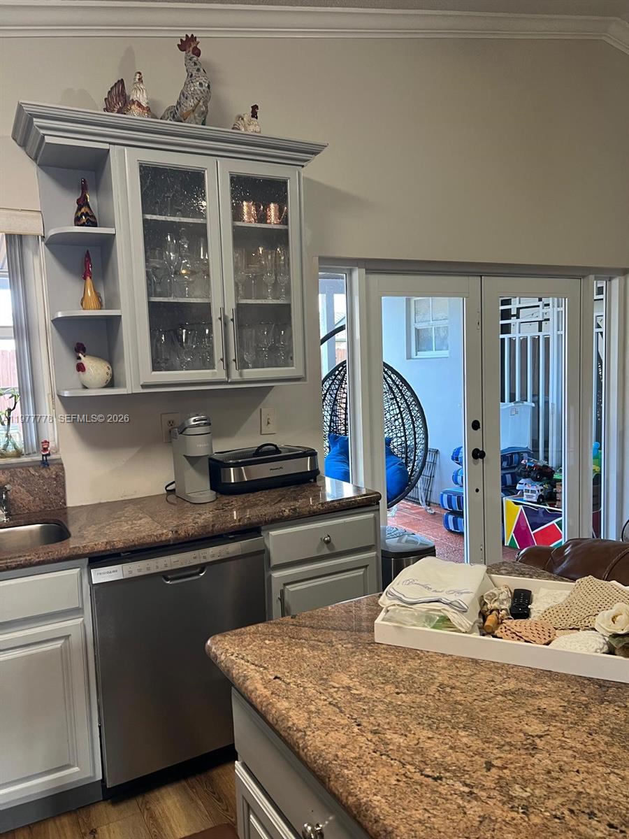 4911 Southwest 142nd Place Miami, FL 33175 - Photo 16 of 34 a view of living room with granite countertop furniture and wooden floor