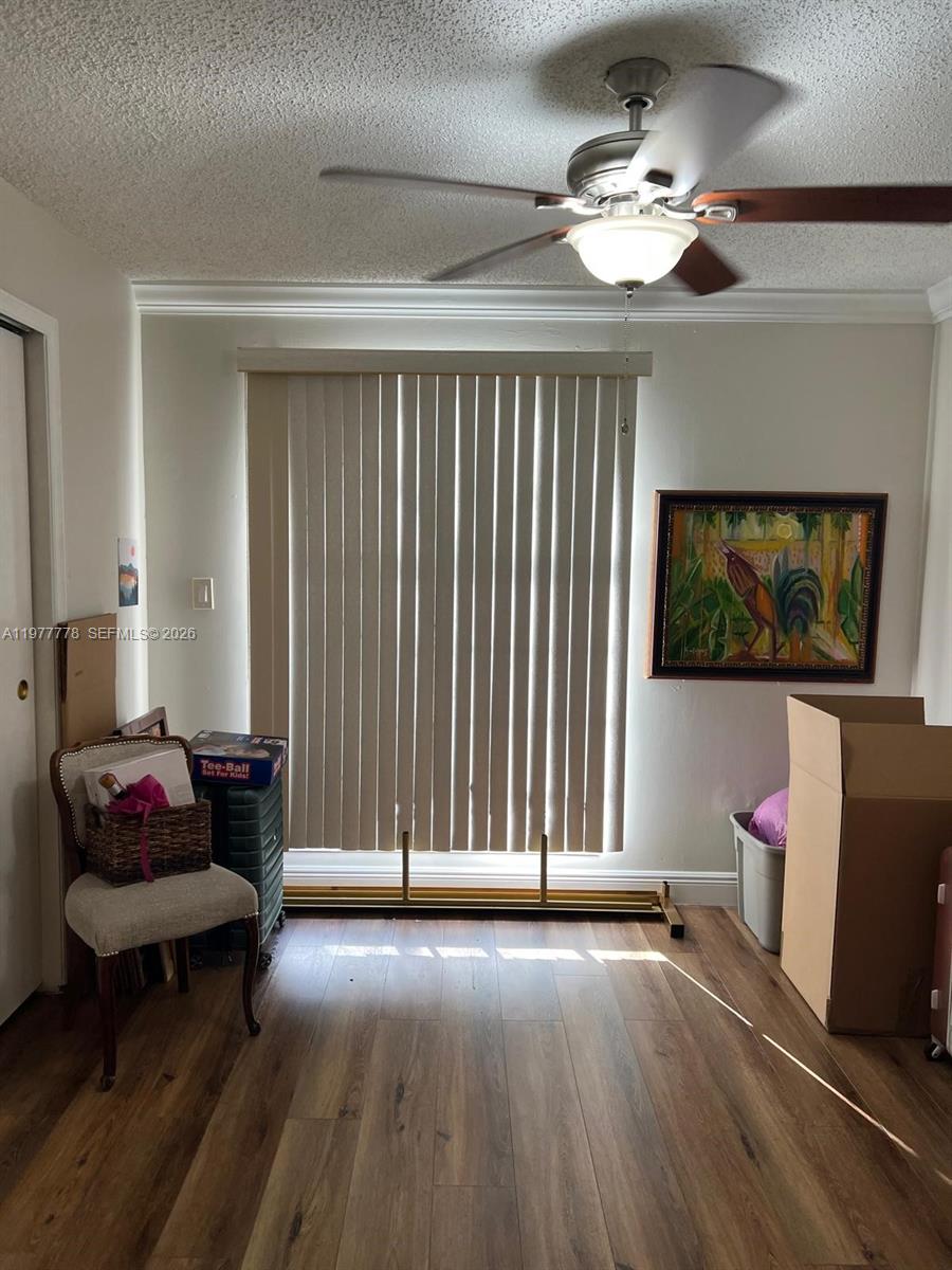 4911 Southwest 142nd Place Miami, FL 33175 - Photo 23 of 34 a living room with furniture and a chandelier