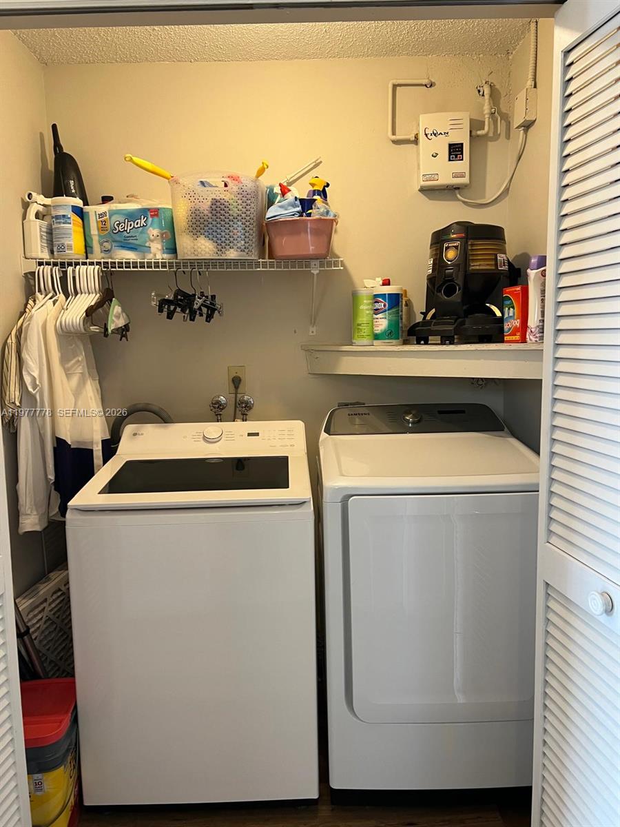 4911 Southwest 142nd Place Miami, FL 33175 - Photo 29 of 34 a utility room with dryer and washer
