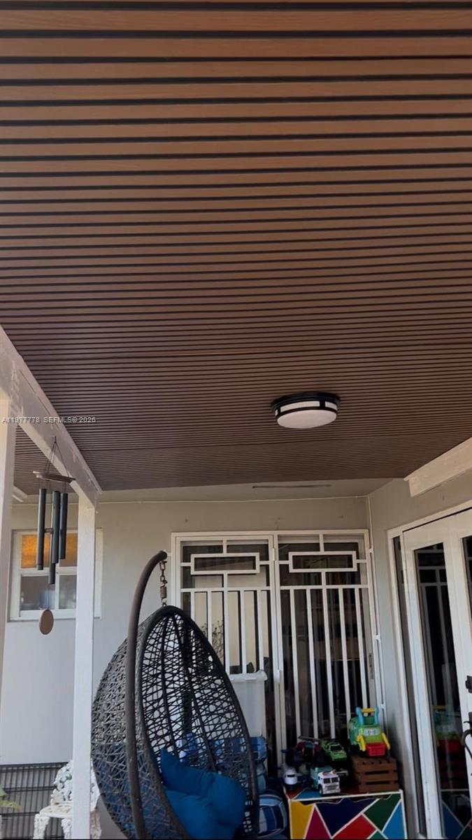 4911 Southwest 142nd Place Miami, FL 33175 - Photo 31 of 34 a view of a hallway with wooden staircase