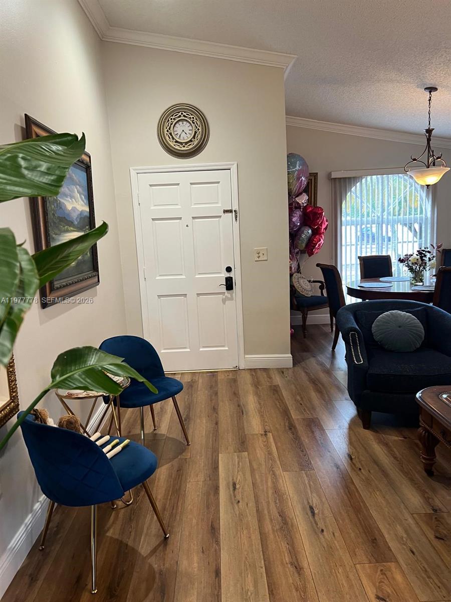 4911 Southwest 142nd Place Miami, FL 33175 - Photo 4 of 34 a living room with furniture and a window