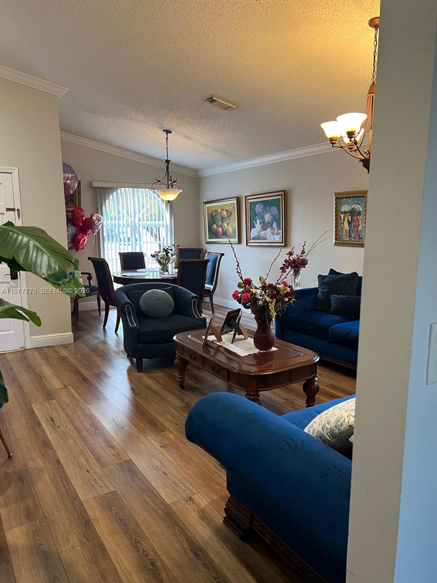 4911 Southwest 142nd Place Miami, FL 33175 - Photo 5 of 34 a living room with furniture and a large window