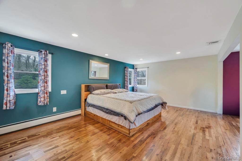 10 Hunting Hill Road Woodbury, NY 11797 - Photo 17 of 39 a bedroom with a bed and window