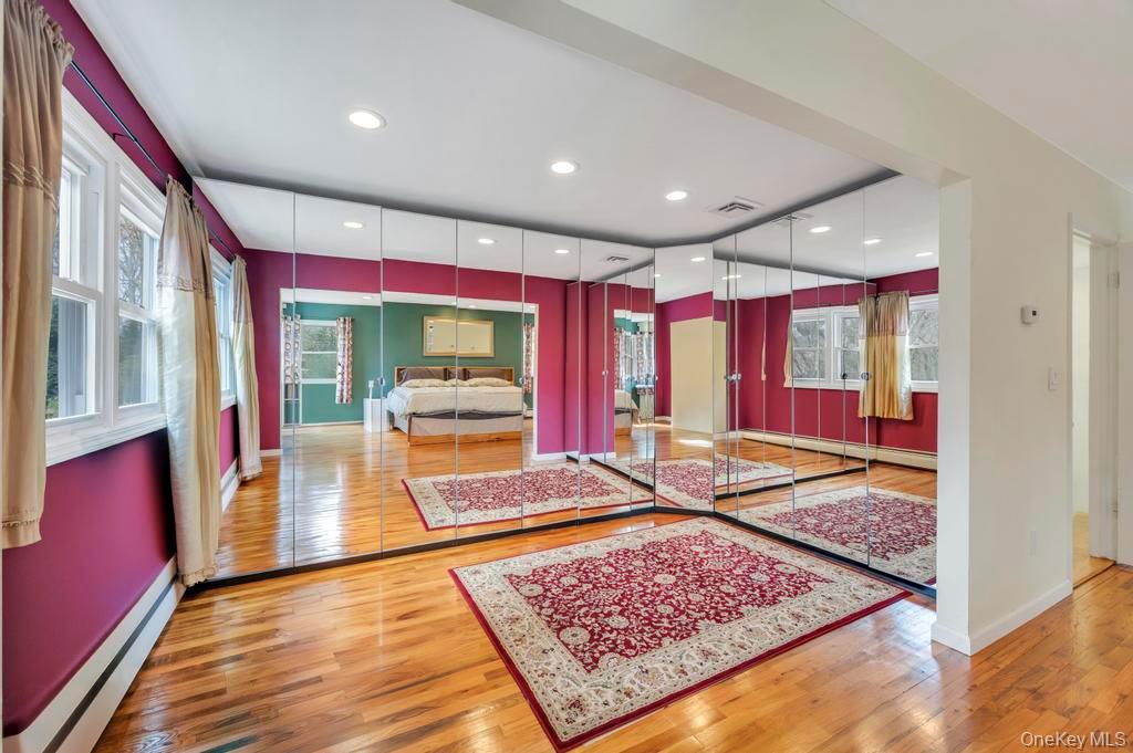 10 Hunting Hill Road Woodbury, NY 11797 - Photo 18 of 39 a very nice looking living room with a rug