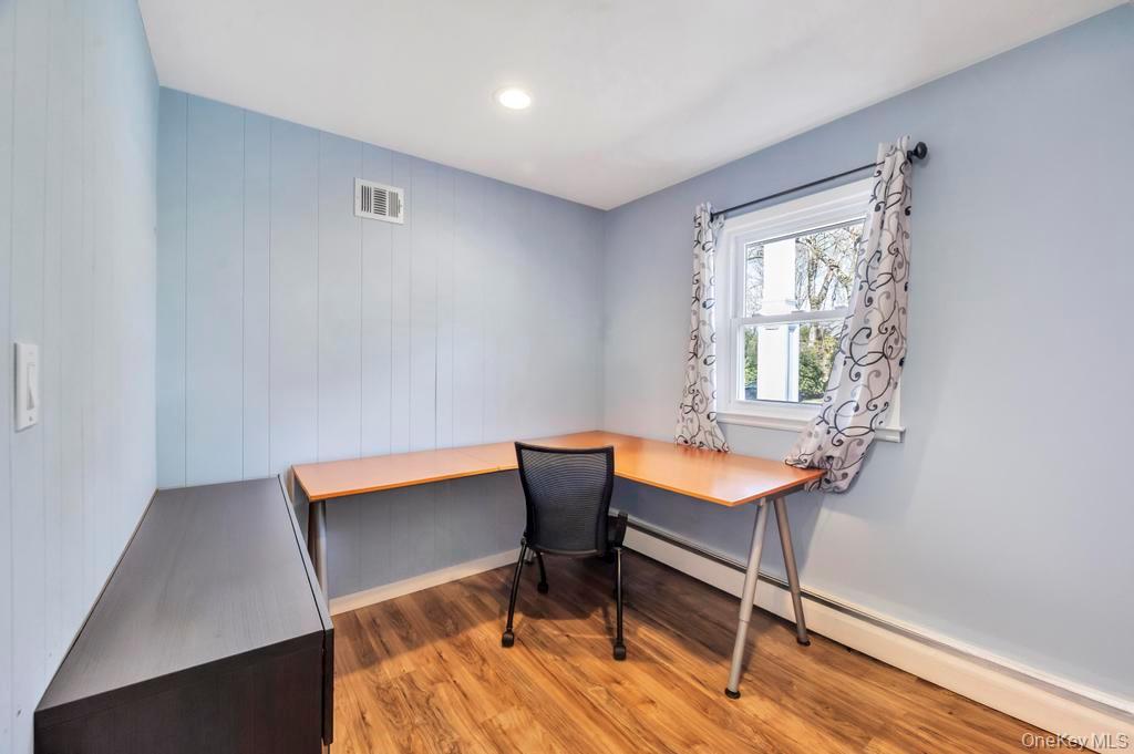 10 Hunting Hill Road Woodbury, NY 11797 - Photo 20 of 39 a room with chairs and a window