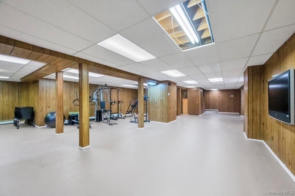 10 Hunting Hill Road Woodbury, NY 11797 - Photo 30 of 39 a view of a room with gym equipment