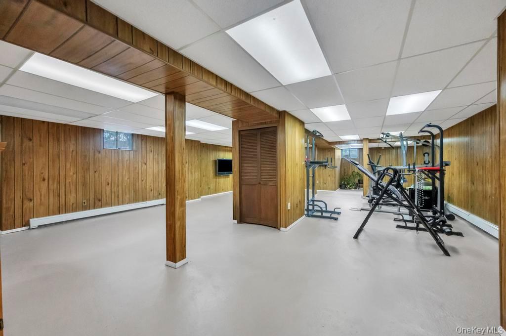 10 Hunting Hill Road Woodbury, NY 11797 - Photo 31 of 39 a view of a room with gym equipment