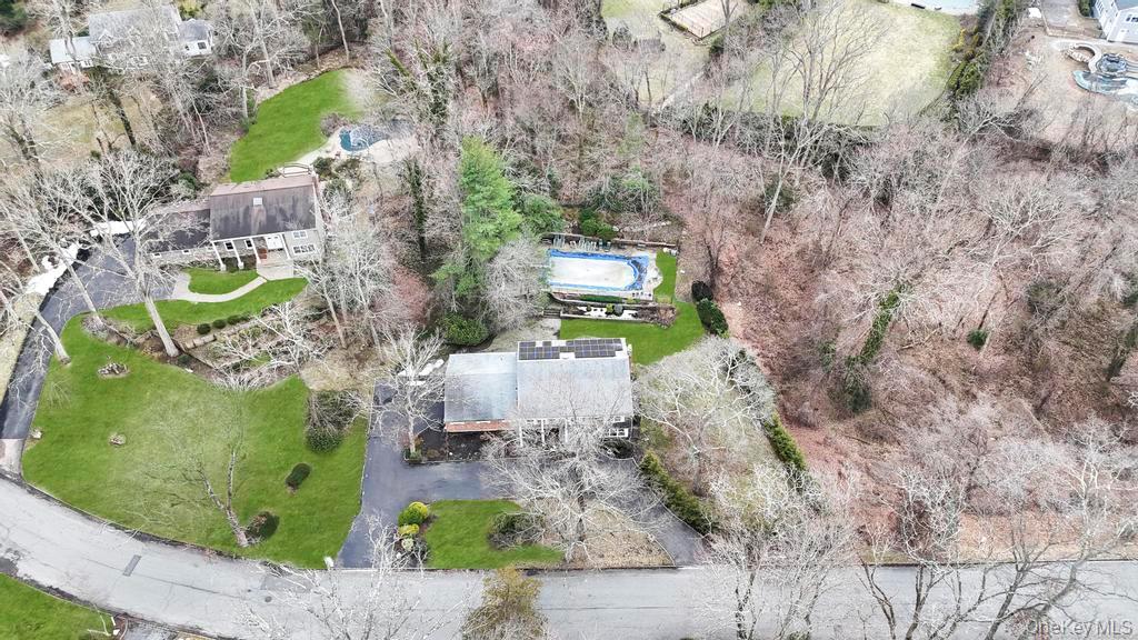 10 Hunting Hill Road Woodbury, NY 11797 - Photo 33 of 39 an aerial view of a house with outdoor space